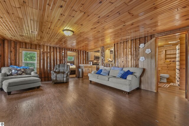 7504 W Dakota Trl, Lake City, MI 49663 - living room with dark wood-style flooring, visible vents, wooden walls, and wood ceiling