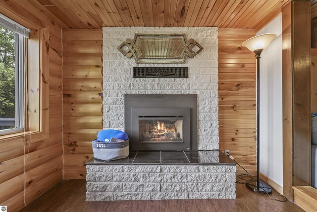 7504 W Dakota Trl, Lake City, MI 49663 - room details with rustic walls, wood finished floors, and wood ceiling