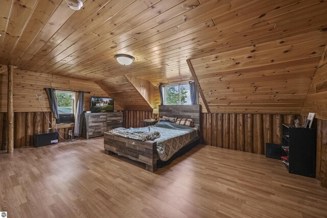 7504 W Dakota Trl, Lake City, MI 49663 - bedroom with wood walls, multiple windows, and wood ceiling