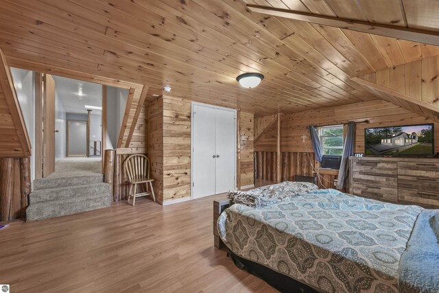7504 W Dakota Trl, Lake City, MI 49663 - bedroom with wooden walls, wooden ceiling, wood finished floors, and cooling unit