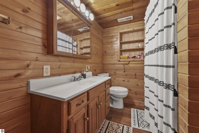 7504 W Dakota Trl, Lake City, MI 49663 - bathroom featuring visible vents, toilet, wooden ceiling, wood finished floors, and wood walls