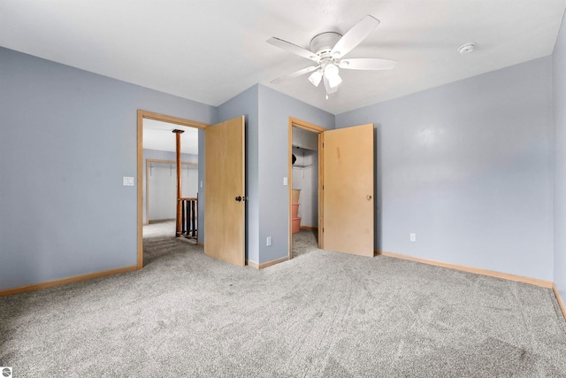 unfurnished bedroom featuring a closet, ceiling fan, and light colored carpet