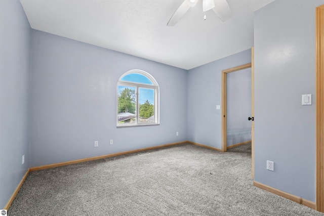 unfurnished room with ceiling fan and carpet floors