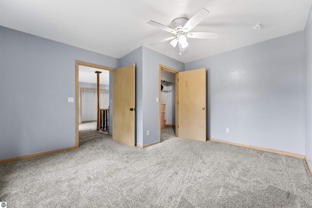 7504 W Dakota Trl, Lake City, MI 49663 - unfurnished bedroom featuring baseboards, a ceiling fan, and carpet flooring