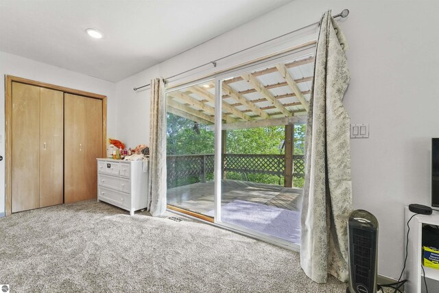 7504 W Dakota Trl, Lake City, MI 49663 - bedroom with access to outside, a closet, and carpet floors