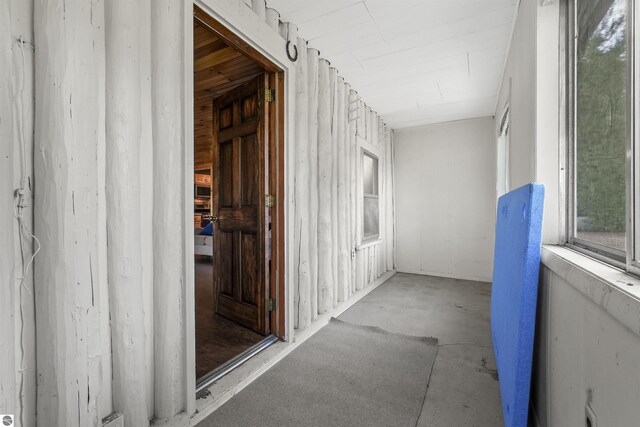 7504 W Dakota Trl, Lake City, MI 49663 - hallway with unfinished concrete floors