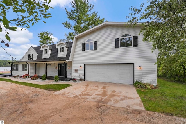 view of front of house featuring covered porch and a garage