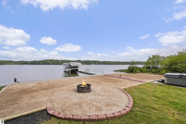 7504 W Dakota Trl, Lake City, MI 49663 - view of dock featuring a water view, a yard, and an outdoor fire pit