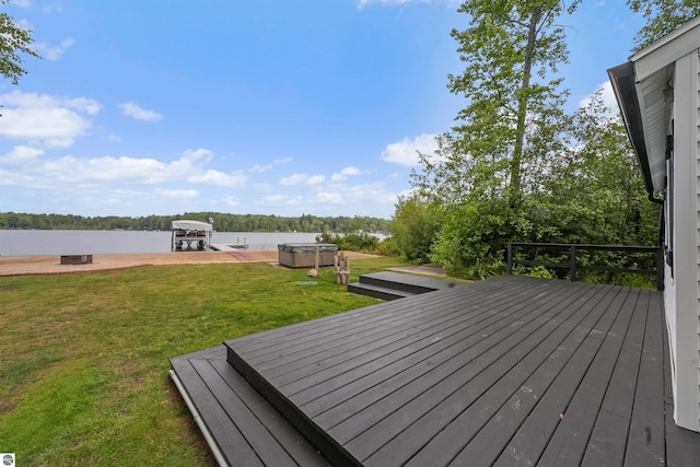 wooden terrace featuring a lawn