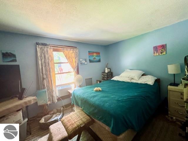 bedroom featuring a textured ceiling