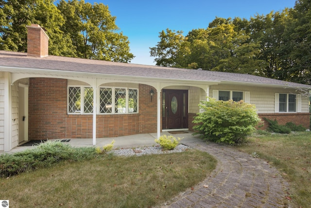 ranch-style house with a front yard