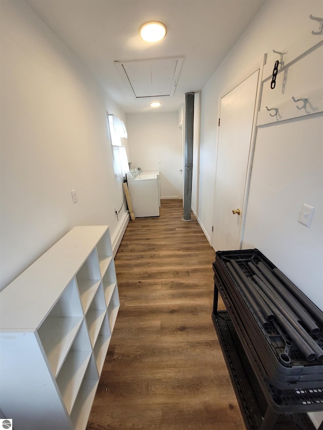 hall featuring washer / dryer and dark hardwood / wood-style floors