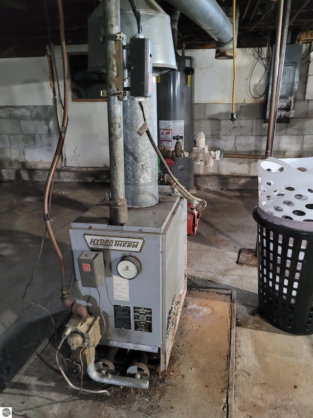 utility room featuring gas water heater