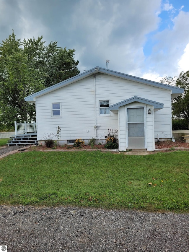 view of home's exterior with a lawn