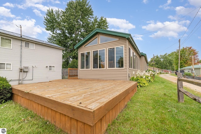 wooden deck with a lawn