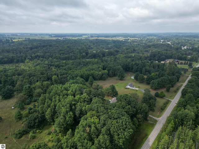 birds eye view of property with a rural view and a view of trees