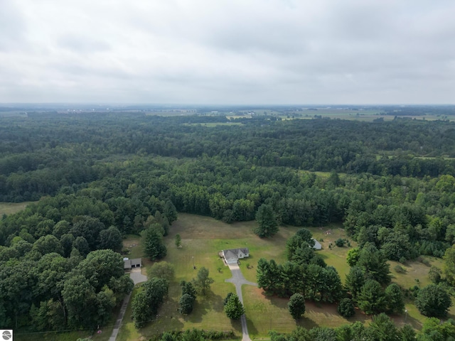 drone / aerial view with a view of trees