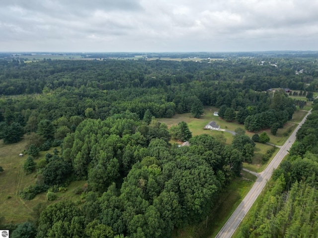 birds eye view of property with a forest view