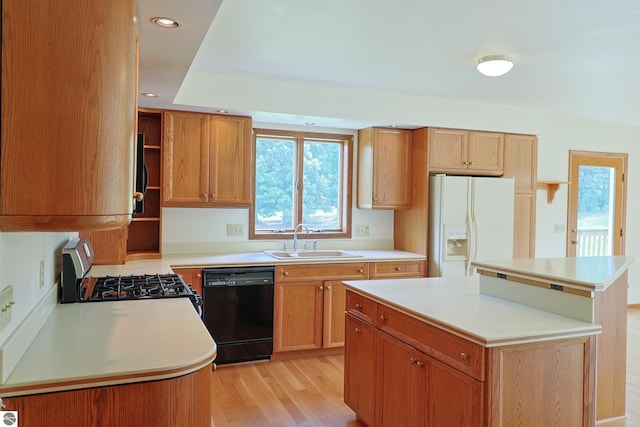 kitchen with gas stove, open shelves, a sink, black dishwasher, and white refrigerator with ice dispenser