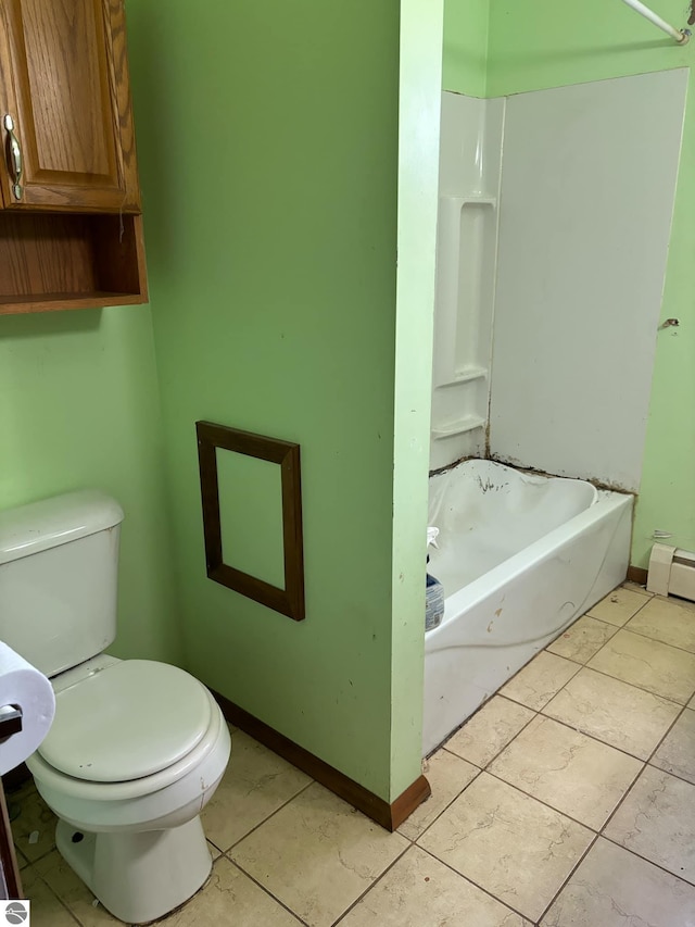 bathroom with tile patterned floors, shower / bathing tub combination, and toilet