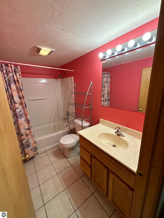 full bathroom with vanity, tile patterned flooring, shower / tub combo, and a textured ceiling