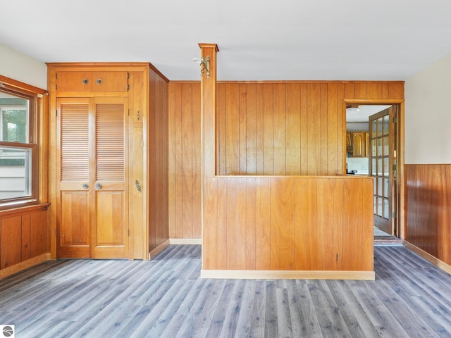 kitchen featuring wood walls and dark hardwood / wood-style floors