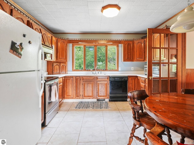 kitchen with black dishwasher, sink, stainless steel range with electric stovetop, white refrigerator, and light tile patterned flooring