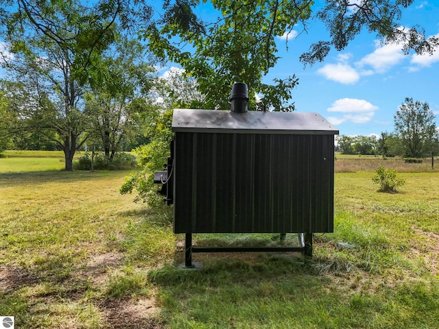 view of outbuilding featuring a yard