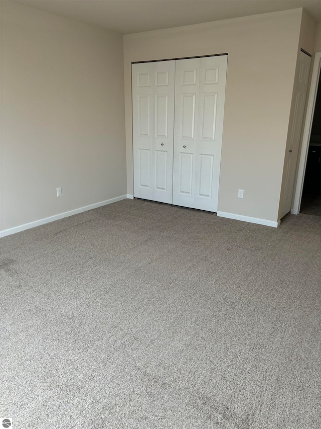 unfurnished bedroom featuring carpet floors