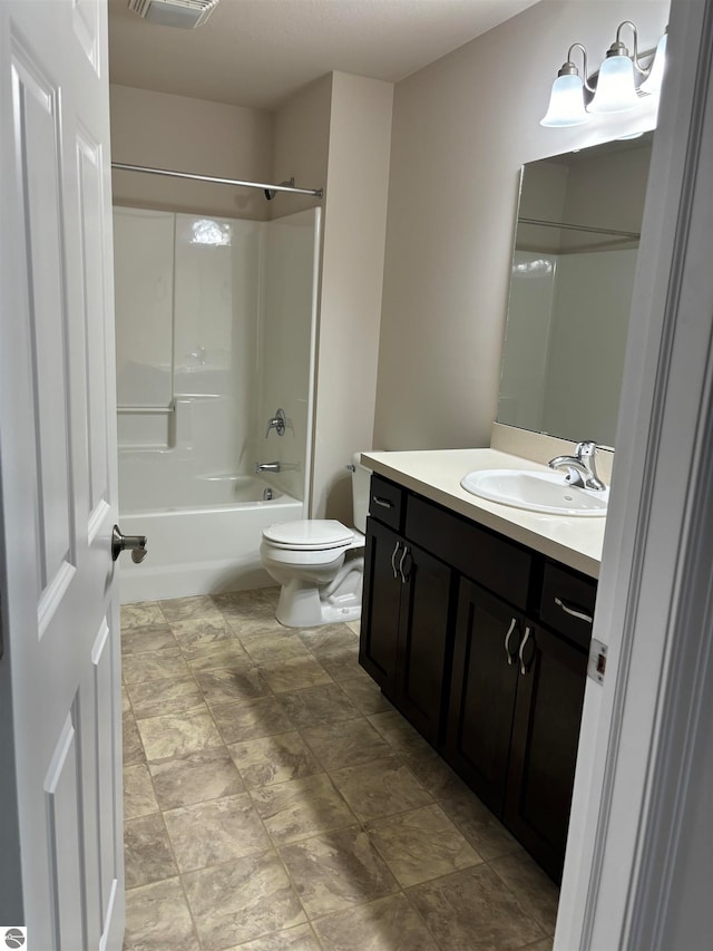 full bathroom featuring toilet, bathing tub / shower combination, and vanity