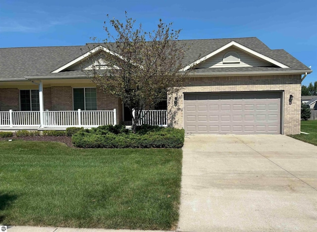 ranch-style house with a porch, a garage, and a front lawn