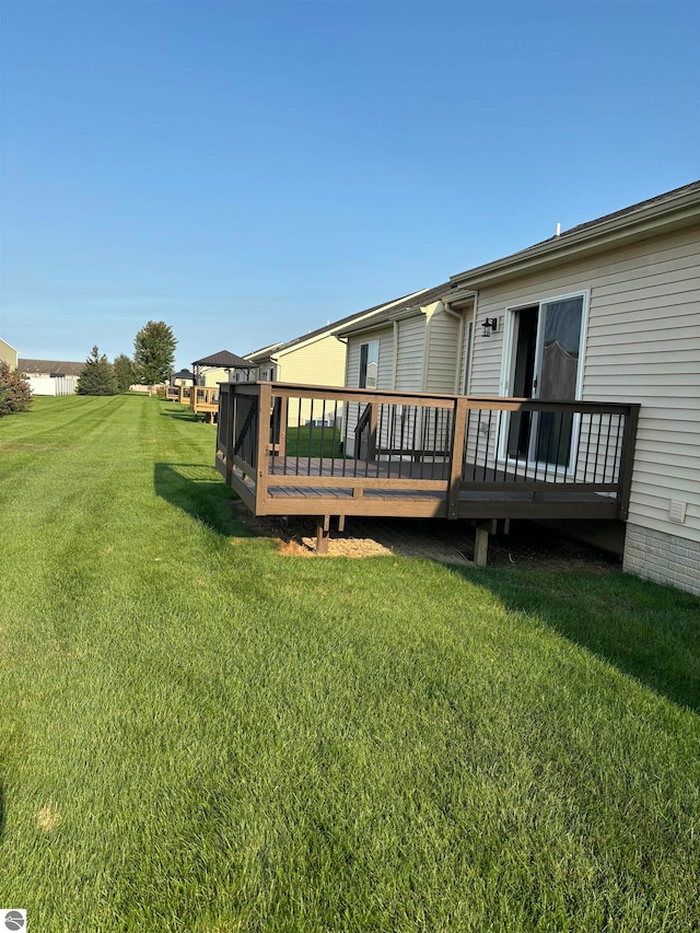 view of yard with a deck