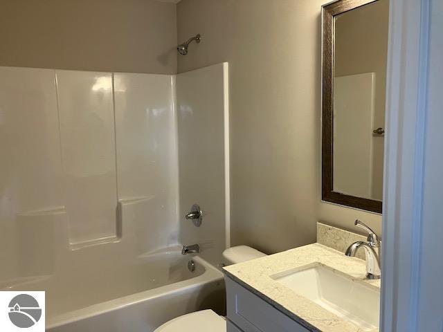 full bathroom with vanity, toilet, and tub / shower combination