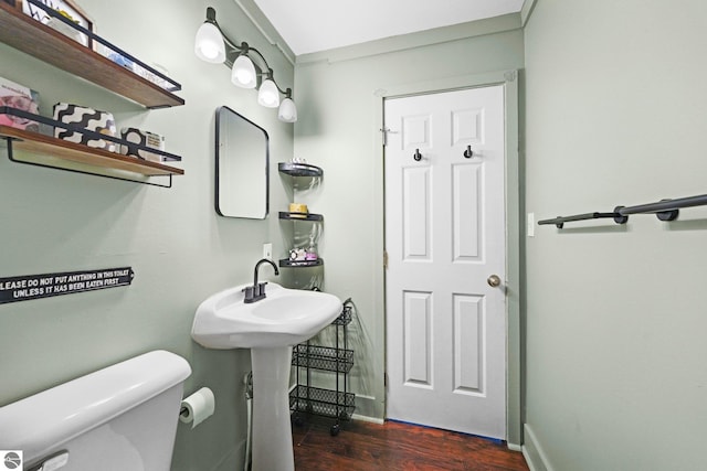 bathroom featuring toilet and hardwood / wood-style floors