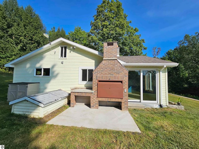 rear view of property with a yard