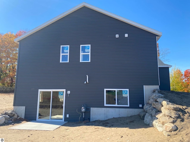 back of property featuring a patio