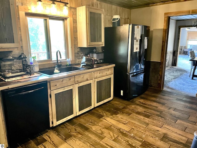 kitchen with black dishwasher, fridge with ice dispenser, dark wood finished floors, and a sink