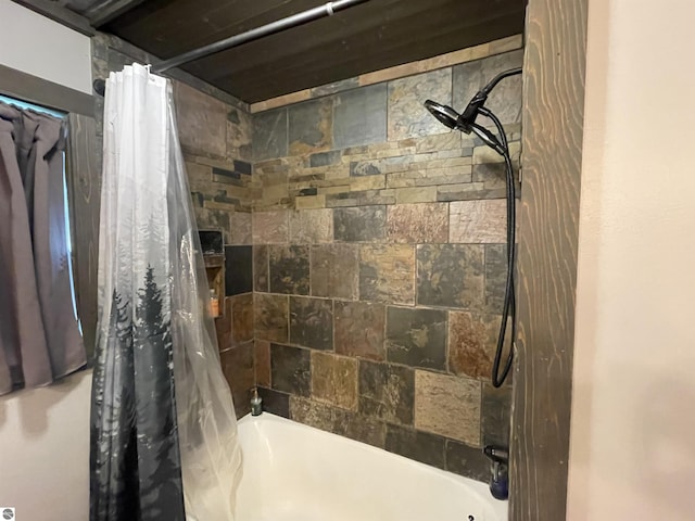 bathroom featuring shower / bath combo with shower curtain