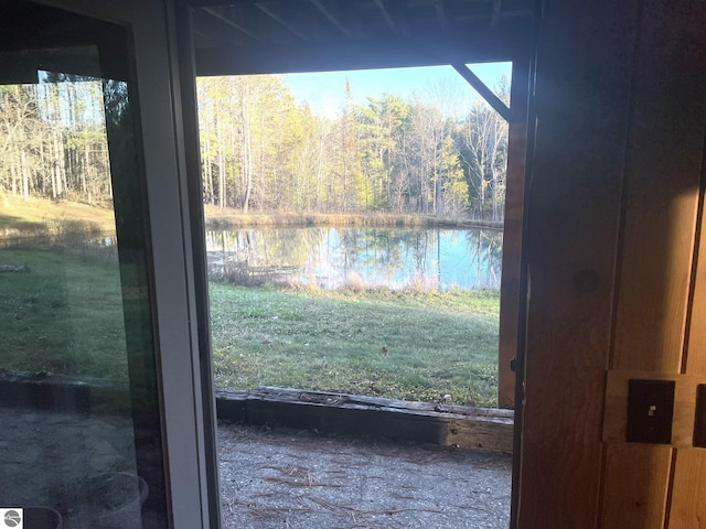 doorway featuring a water view and a healthy amount of sunlight