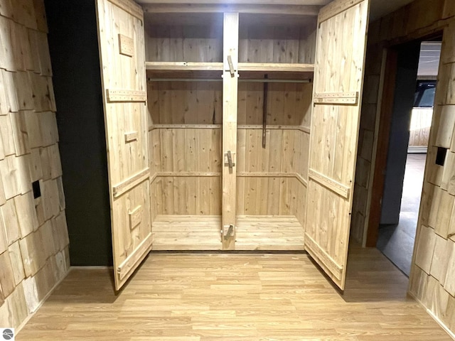 mudroom with light wood finished floors