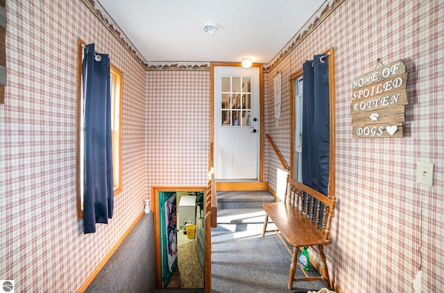 interior space featuring a textured ceiling and carpet floors