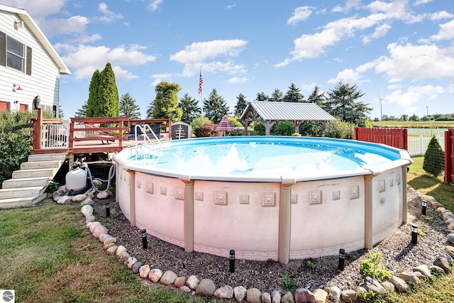 view of swimming pool with a deck