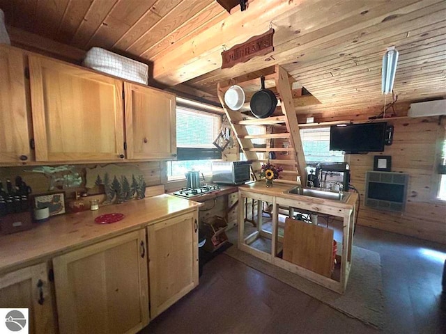 kitchen featuring sink, dark hardwood / wood-style floors, wooden ceiling, and heating unit