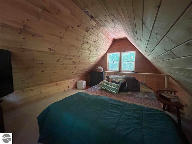 bedroom with wooden ceiling, vaulted ceiling, and wooden walls