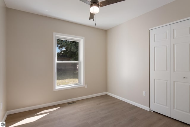 interior space with ceiling fan and light hardwood / wood-style floors