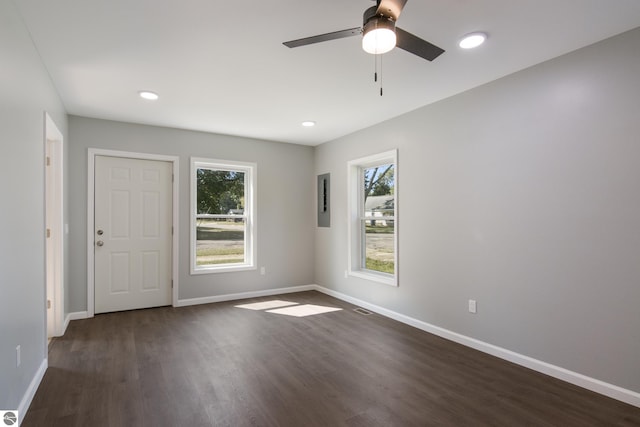 spare room with ceiling fan and dark hardwood / wood-style flooring