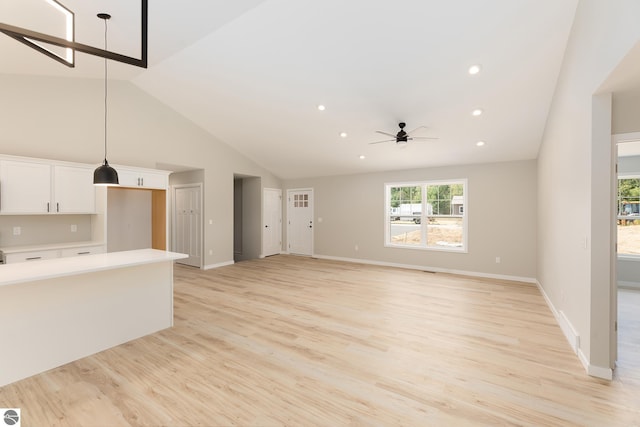 unfurnished living room with baseboards, recessed lighting, light wood-style flooring, and a ceiling fan