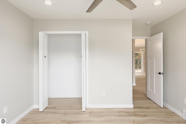 unfurnished bedroom with baseboards, light wood finished floors, a ceiling fan, and recessed lighting