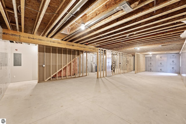 unfinished basement featuring electric panel