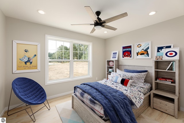 bedroom featuring baseboards, wood finished floors, a ceiling fan, and recessed lighting